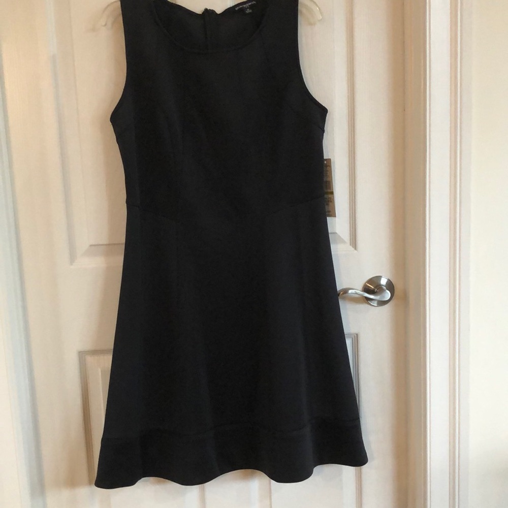 New black dress, never worn. Size 14, brand Sharagano.